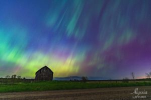Northern Lights over a farm.